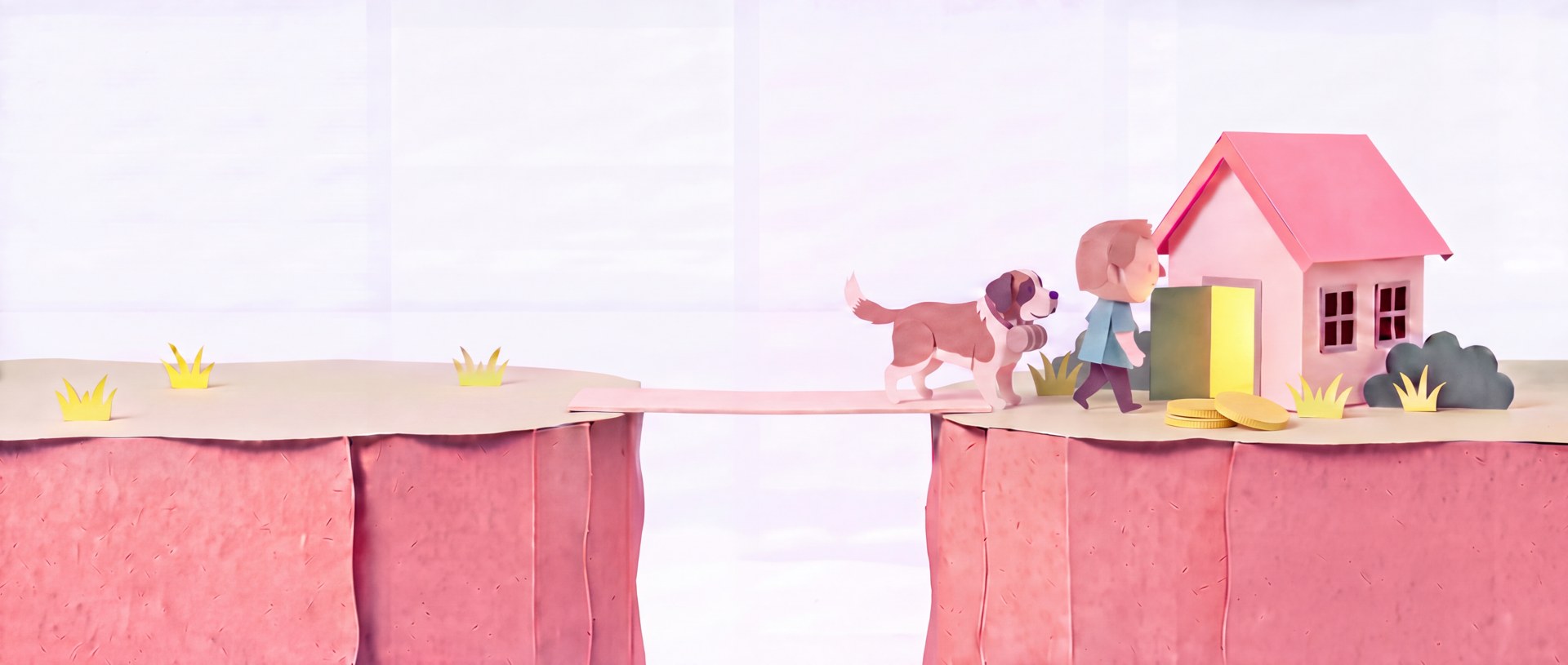 A cut-paper scene of a man and his St Bernard arriving at a lit cottage across a bridged gap